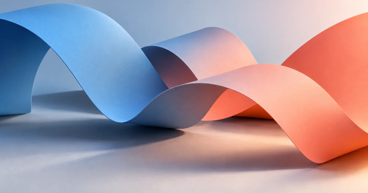 Curved sheets transition from blue to coral above a matte surface, with soft overlapping shadows that show their depth.
